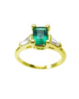 A natural colombian emerald ring with side baguette diamonds, the May's birthstone jewelry.