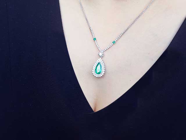 Real Muzo emerald necklace halo diamonds