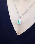 Real Muzo emerald necklace halo diamonds