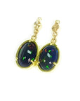 Ethiopian Welo black opal oval earrings with bluish-green and red-orange fire, set in 14K yellow gold.