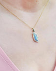 Opal and diamond pendant