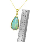 Yellow gold Ethiopian opal pendant