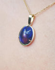Ethiopian black opal in solid gold necklace