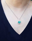Emerald pendant with halo diamonds