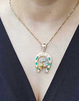 Emerald and diamond horseshoe pendants