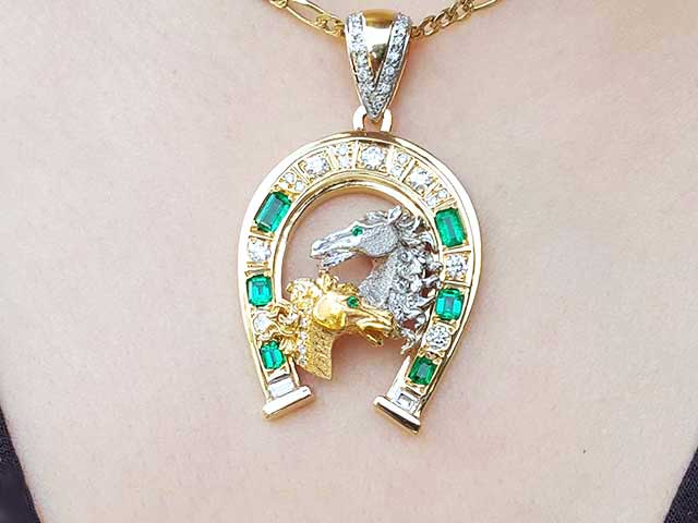 Emerald and diamond horseshoe pendant