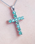 White gold emerald cross necklace