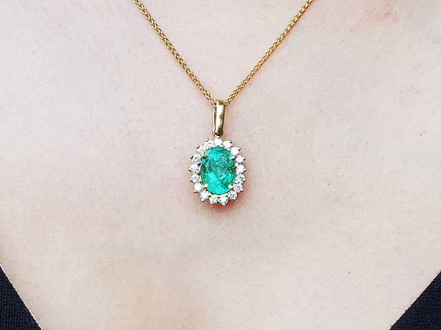Halo diamond oval emerald pendant necklace