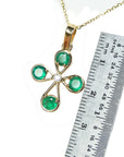 18k emerald cross pendant