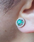 Colombian emerald and halo diamond stud earrings