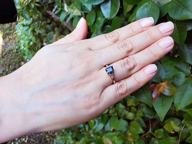 Sapphire and baguette diamond three stone ring
