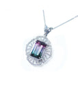 A tourmaline and diamond necklace in white gold with on a white background.
