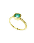 14K yellow gold ring with a bezel-set octagonal emerald and diamond accents on the band.