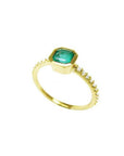 14K yellow gold ring with a bezel-set octagonal emerald and diamond accents on the band.