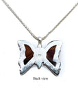 Back view of a sterling silver butterfly pendant necklace with orange, brown, and black agate.
