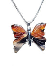 Sterling silver necklace with an orange, brown, and black agate butterfly pendant.