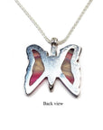 Back view of a silver butterfly agate pendant with pink wings on a silver chain.