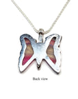 Back view of a silver butterfly agate pendant with pink wings on a silver chain.