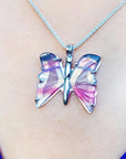Handcrafted butterfly agate pendant necklace with pink wings, made of 925 sterling silver.