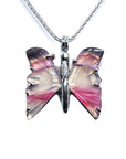 Butterfly-shaped agate sterling silver pendant with pink and purple wings on a white background