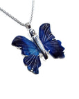 Blue agate butterfly pendant on a silver chain against a white background