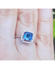 Asscher cut blue sapphire ring for women halo diamonds 18k white gold on a finger