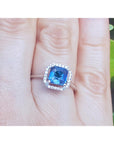 Asscher cut blue sapphire ring for women halo diamonds 18k white gold on a finger