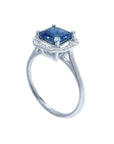 Asscher cut blue sapphire ring with halo diamonds in 18k white gold.
