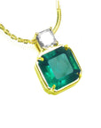 Ringt position plain top view of a women's emerald necklace, this Asscher cut natural Colombian emerald is from Muzo