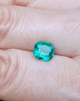 Gia certified loose emerald square modified brilliant cut on hand display
