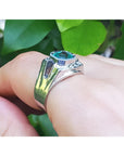 1.94 ct Asscher cut bluish-green emerald ring in 18K white gold, bezel set.