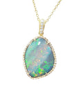 Opal pendant necklace with gold chain on a topside position displaying the frame with diamonds.