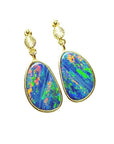 14K yellow gold dangle earrings with bezel-set, iridescent blue Australian opal doublets.