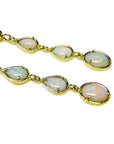 Handcrafted 14k yellow gold earrings with three pear and oval-cut natural Australian opals.