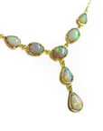 Handcrafted 14K yellow gold necklace with multiple iridescent Australian opal gemstones in oval and teardrop shapes.