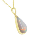 Teardrop-shaped opal pendant on a gold chain displaying its right-side profile, top and gallery view.