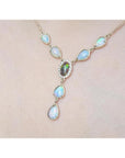 14k yellow gold necklace with a black Australian opal haloed by diamonds, surrounded by teardrop opals.