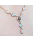 14k yellow gold Australian black opal and diamond halo necklace with teardrop opals.