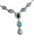 14k yellow gold necklace with a black Australian opal haloed by diamonds, and seven pear-shaped opals.