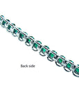 Back view of a Colombian emerald tennis bracelet in 14K white gold, showing the setting.