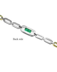 Back of 14K white and yellow gold paperclip bracelet with emerald-cut emerald.