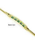Back view of a 14K yellow gold bracelet with rectangular bluish-green emeralds.