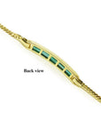 Back view of a 14K yellow gold bracelet with rectangular bluish-green emeralds.