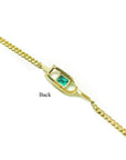 A yellow gold emerald bracelet displaying the backside view.