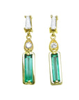 Front position of a baguette cut emerald and diamond pair of earrings in 14k yellow gold, top side view
