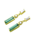 14K gold stud earrings with baguette-cut emeralds, pear-shaped extensions, and tapered baguette diamonds.