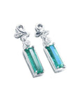 Pair of baguette cut natural emerald earrings made of 14k white gold.