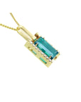 5.15 ct. baguette-cut Colombian emerald pendant in 18K yellow gold with diamond accents.