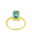 18K yellow gold ring with a baguette-cut emerald centerpiece and two baguette diamonds on each side.