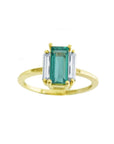 A baguette cut natural colombian emerald and diamond side ring for women in 18k yellow gold.